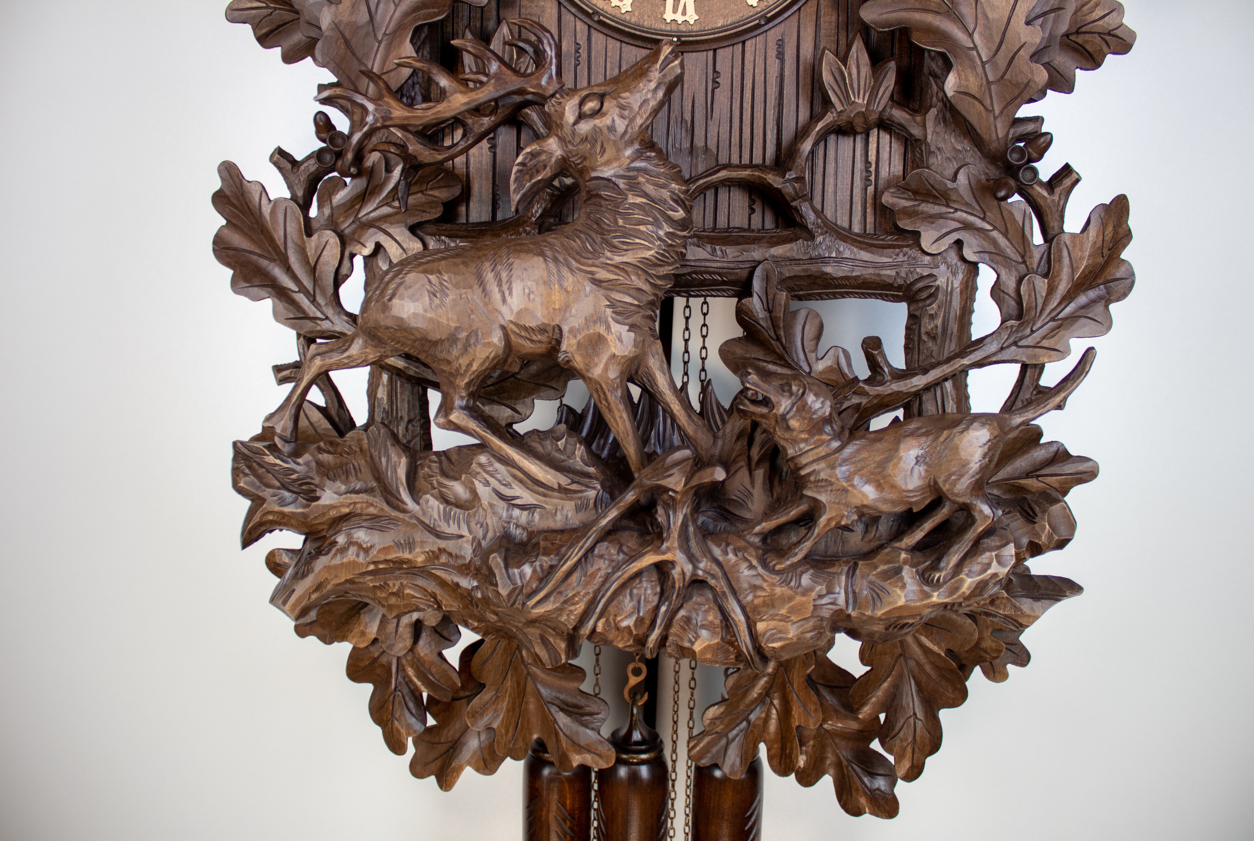 Historical 8 Days Music Dancer Cuckoo Clock with eagle and hunting scene with deer and hunting dog