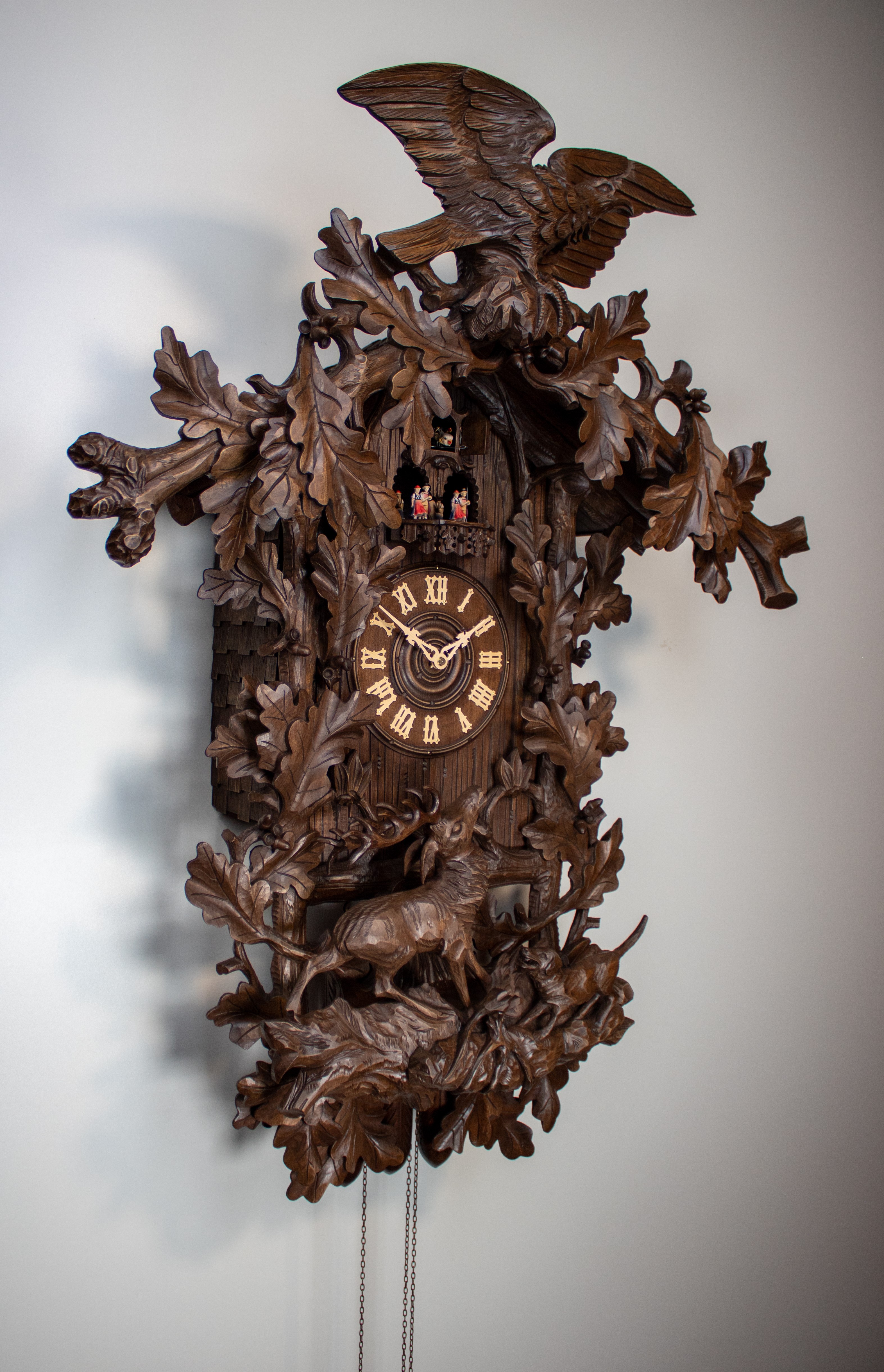 Historical 8 Days Music Dancer Cuckoo Clock with eagle and hunting scene with deer and hunting dog